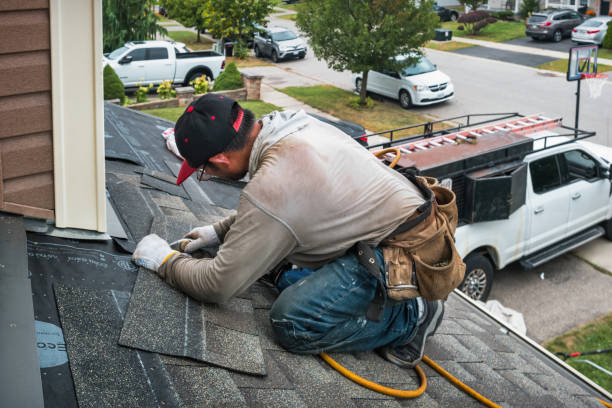Professional Roofing technician working in Woodburn, IA